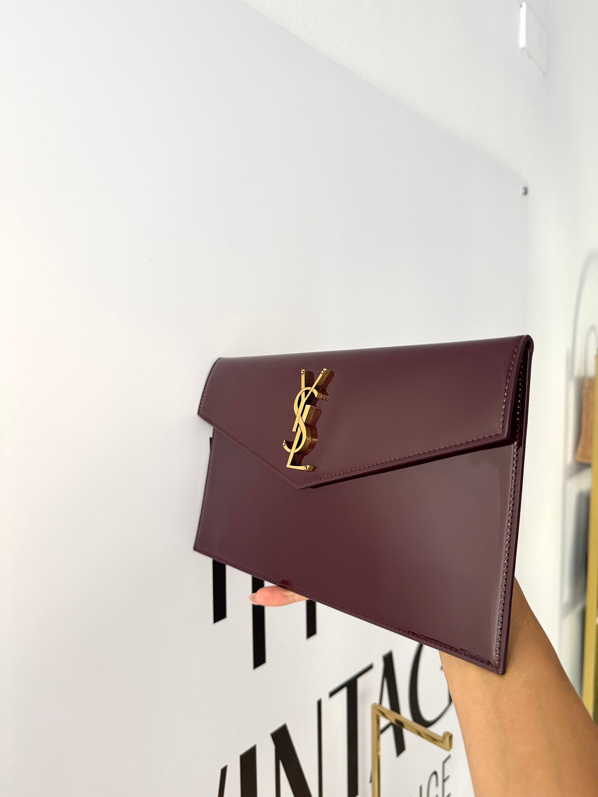 Pochette Uptown in pelle verniciata Saint Laurent