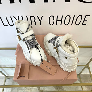 Stivaletti in pelle con shearling Miu Miu