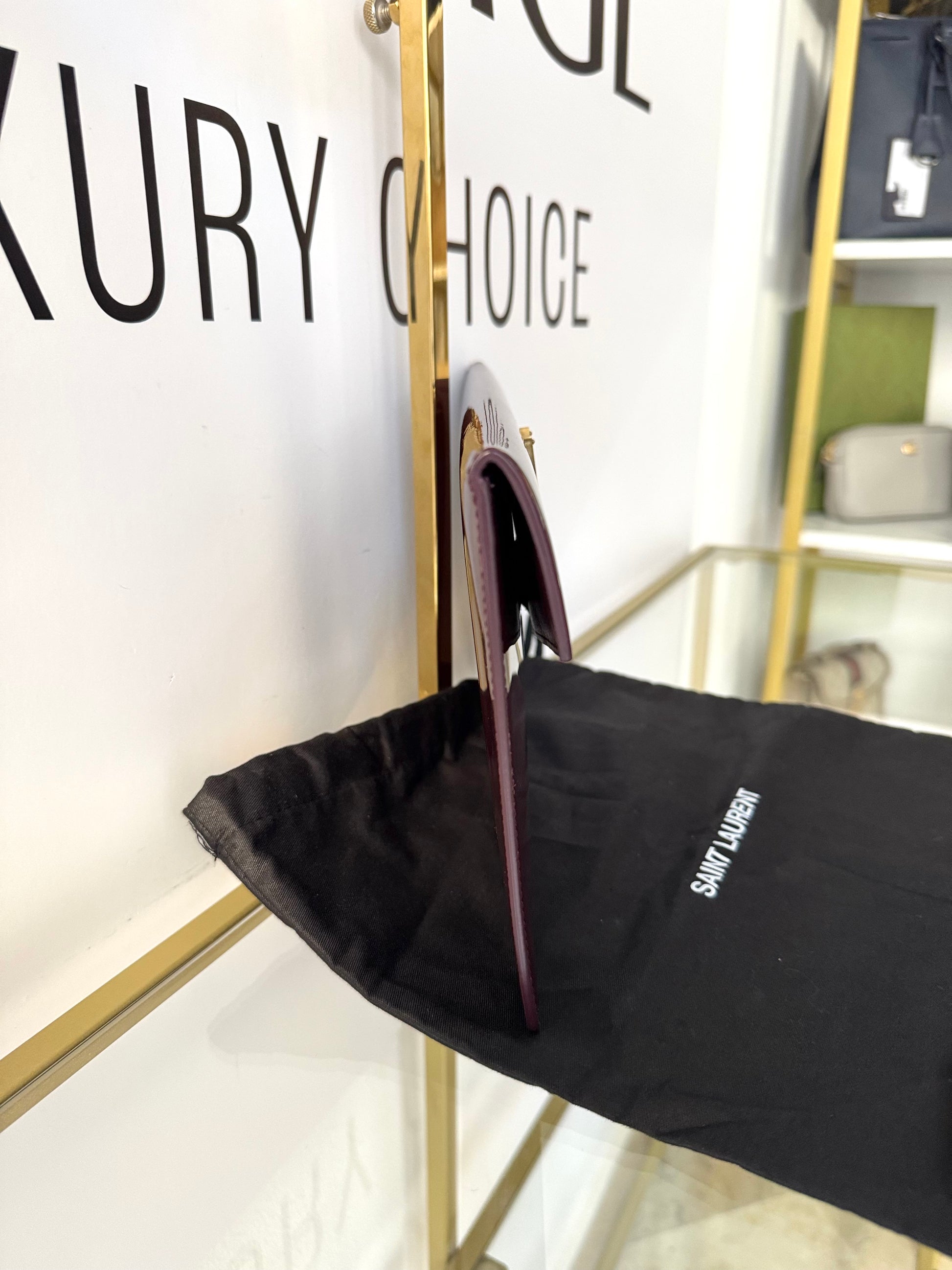 Pochette Uptown in pelle verniciata Saint Laurent
