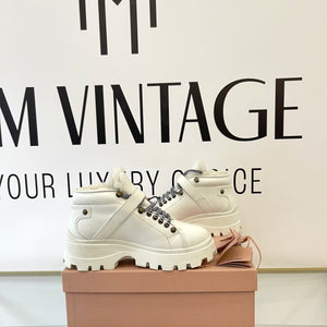 Stivaletti in pelle con shearling Miu Miu