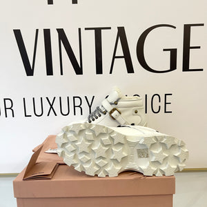 Stivaletti in pelle con shearling Miu Miu