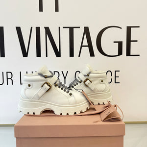 Stivaletti in pelle con shearling Miu Miu