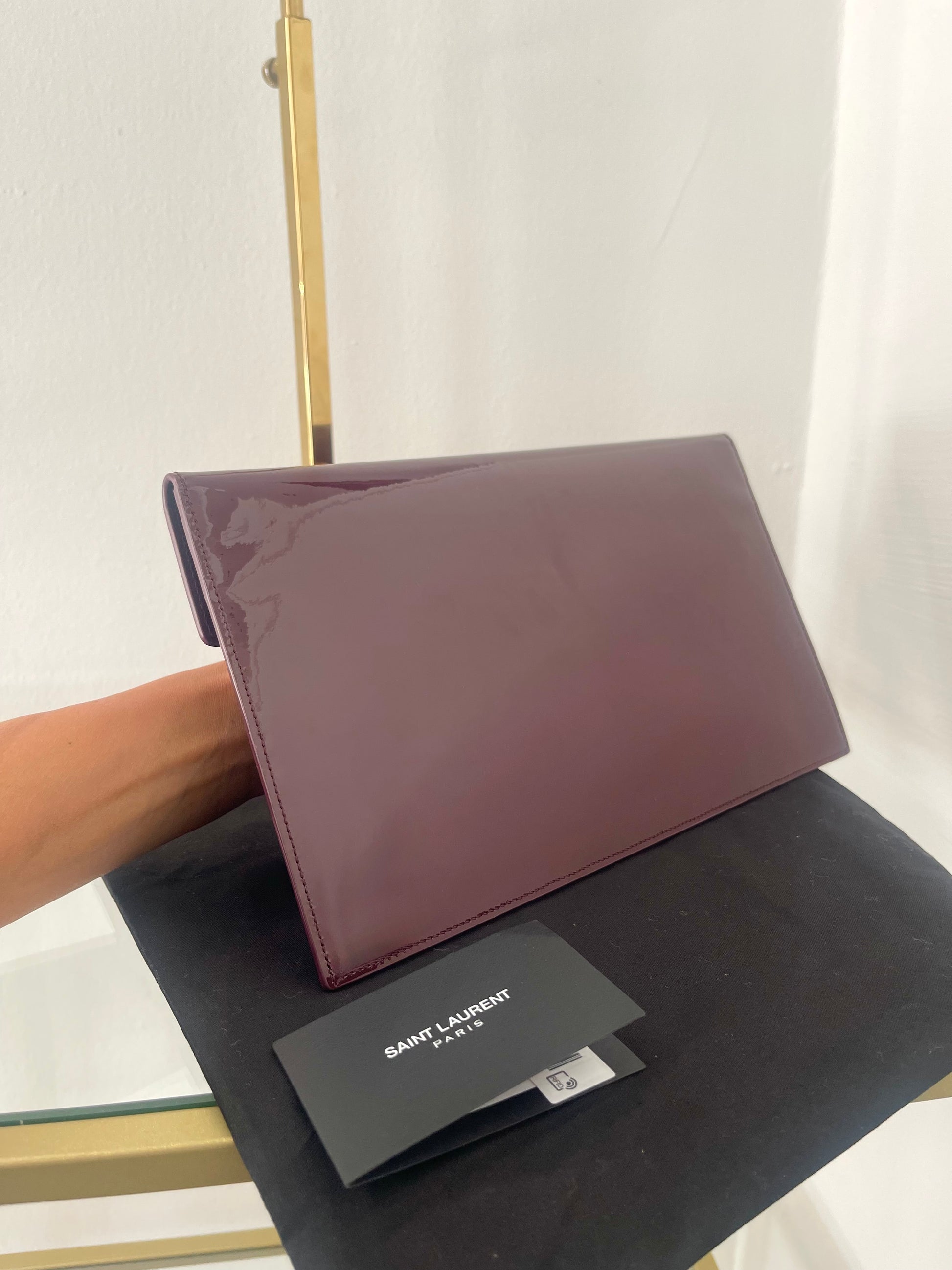 Pochette Uptown in pelle verniciata Saint Laurent