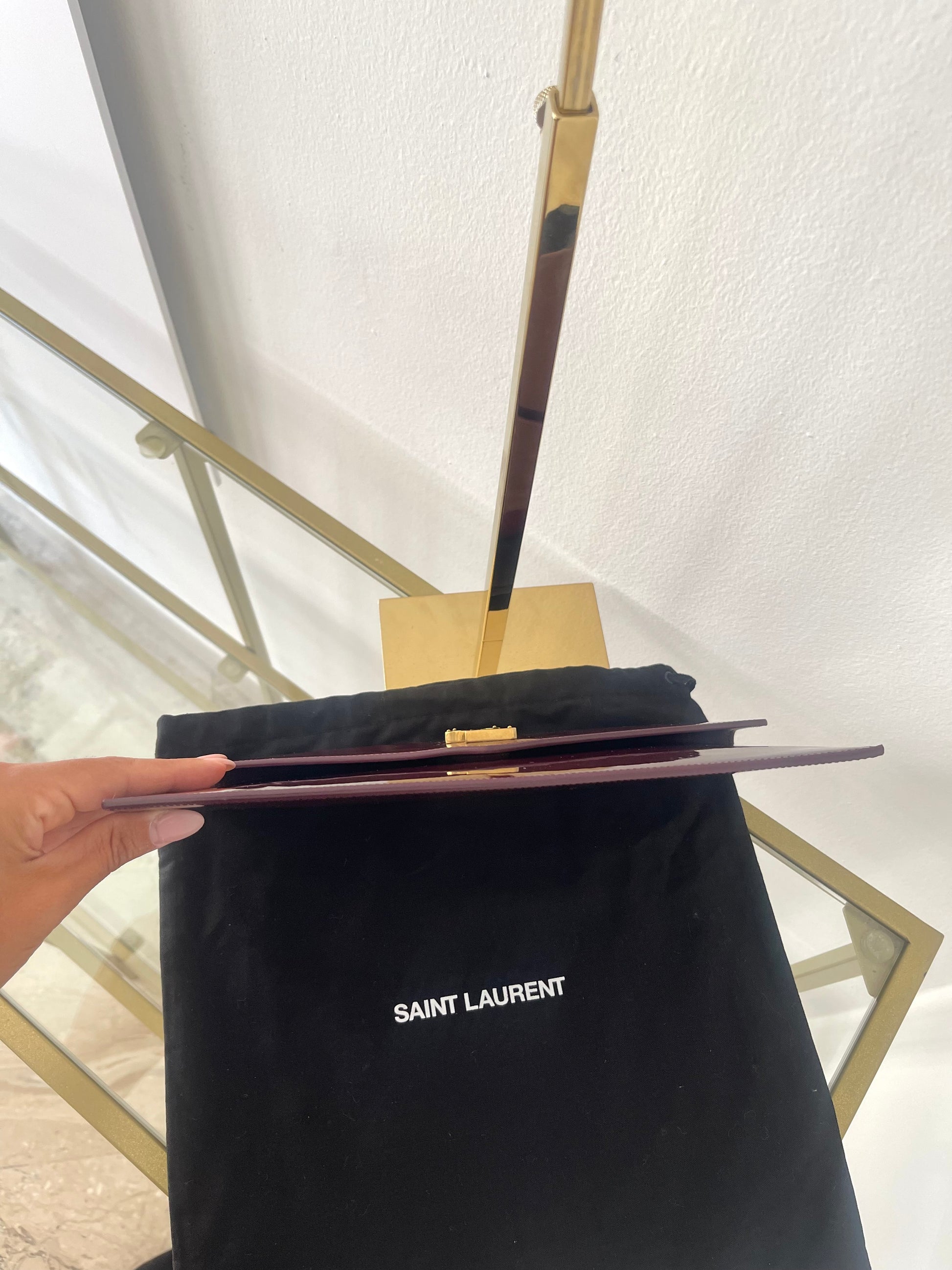Pochette Uptown in pelle verniciata Saint Laurent