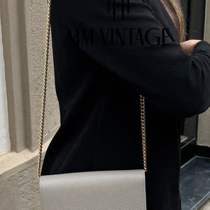 Pochette GG Marmont con catena Gucci
