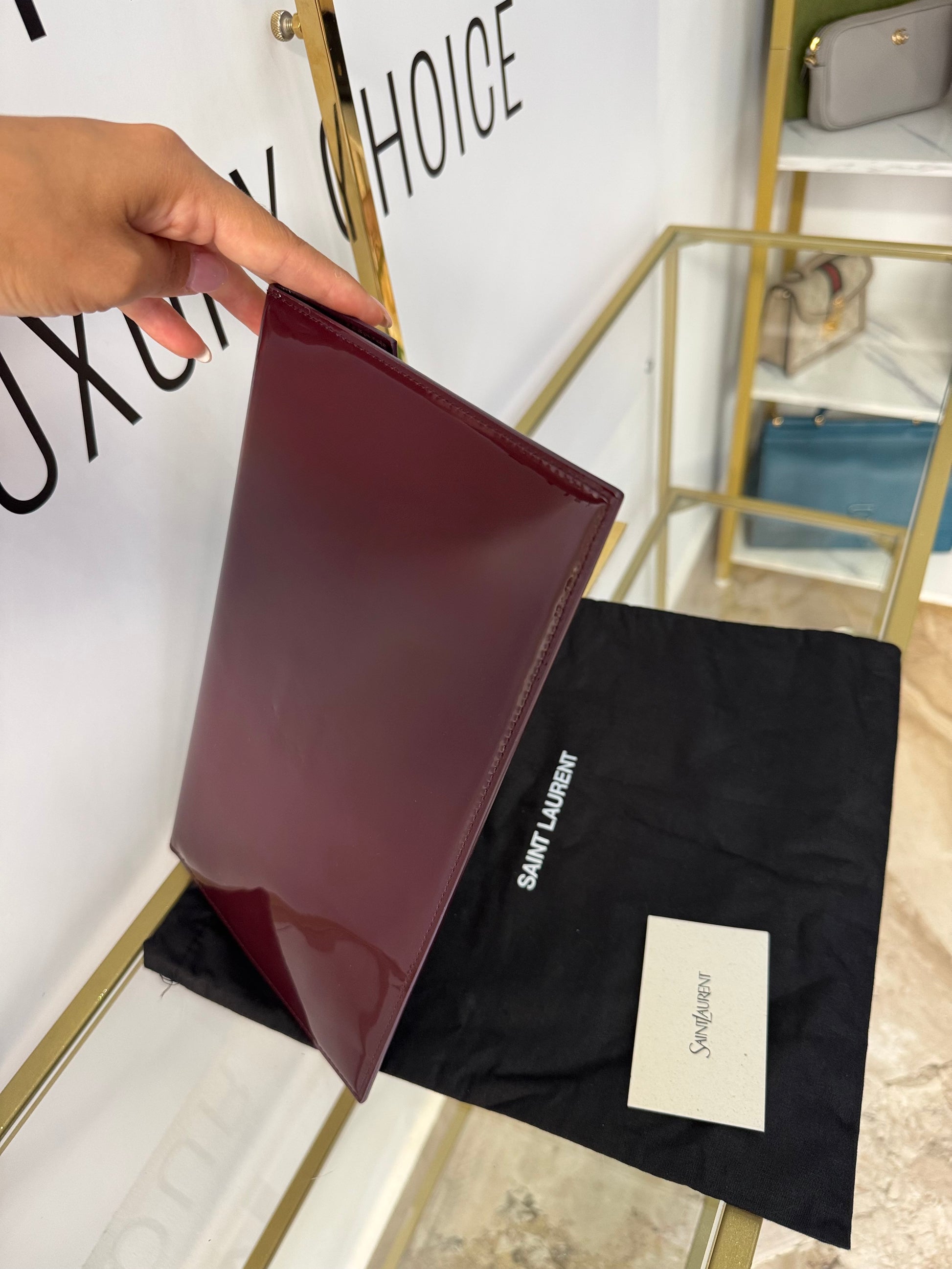 Pochette Uptown in pelle verniciata Saint Laurent
