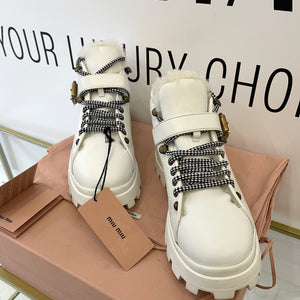 Stivaletti in pelle con shearling Miu Miu