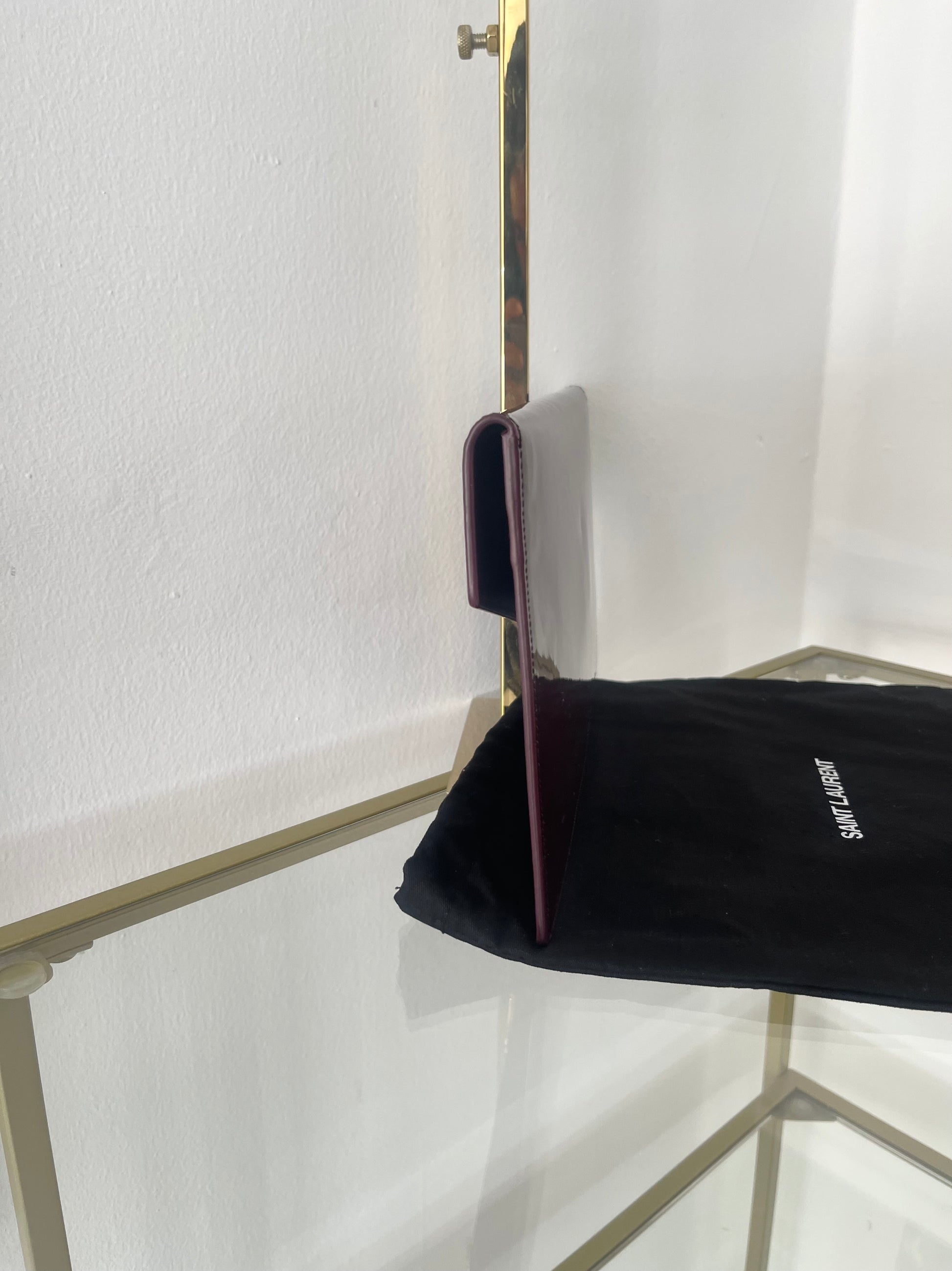Pochette Uptown in pelle verniciata Saint Laurent