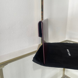 Pochette Uptown in pelle verniciata Saint Laurent