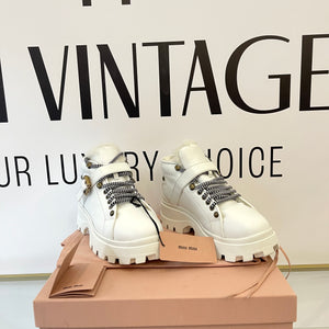 Stivaletti in pelle con shearling Miu Miu