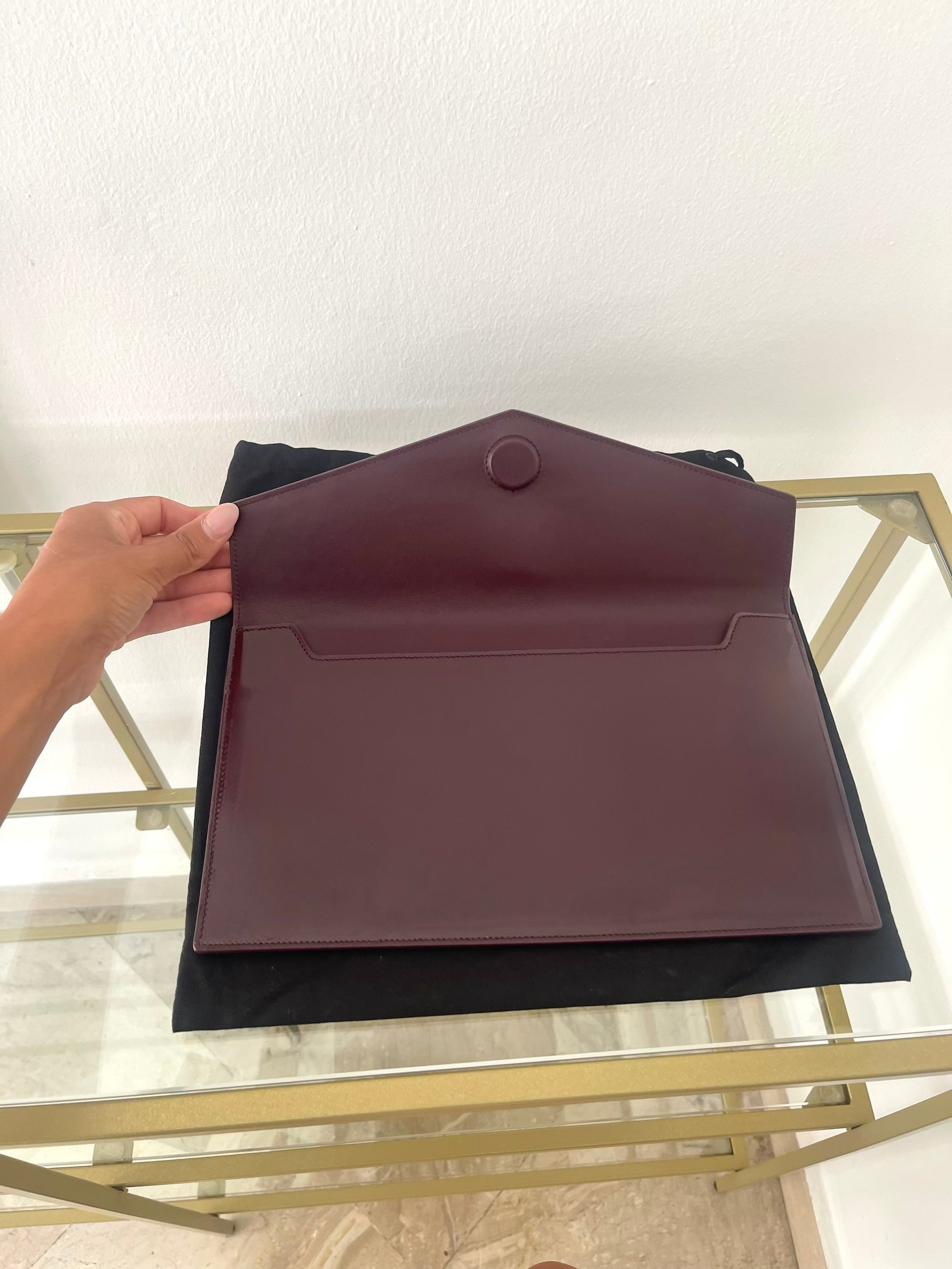 Pochette Uptown in pelle verniciata Saint Laurent