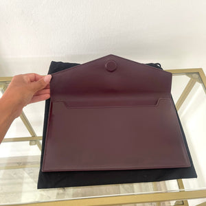 Pochette Uptown in pelle verniciata Saint Laurent