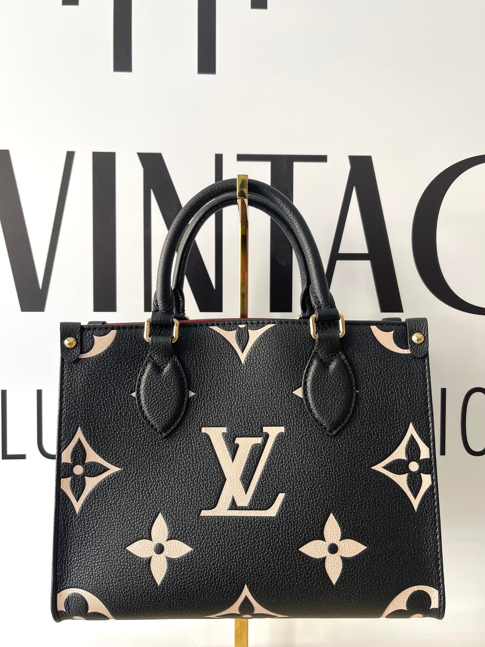 Borsa OnTheGo PM Monogram Empreinte Bicolor Louis Vuitton