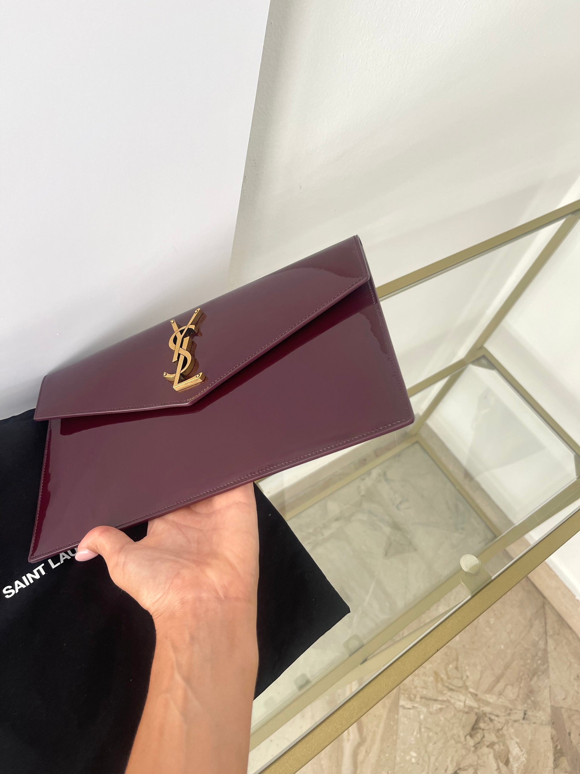Pochette Uptown in pelle verniciata Saint Laurent