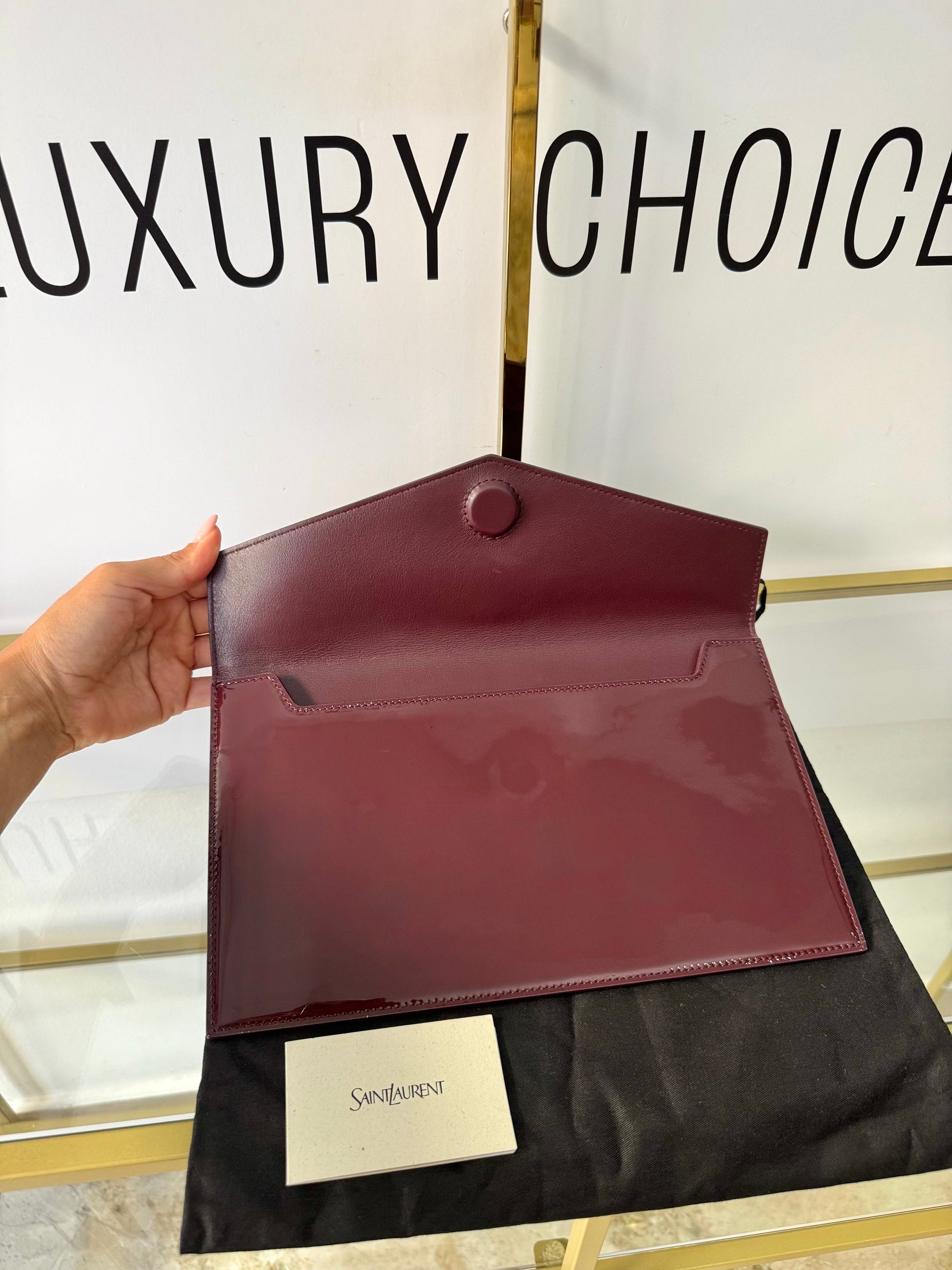 Pochette Uptown in pelle verniciata Saint Laurent