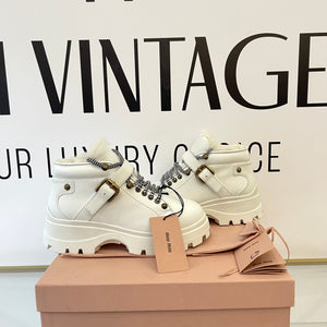 Stivaletti in pelle con shearling Miu Miu