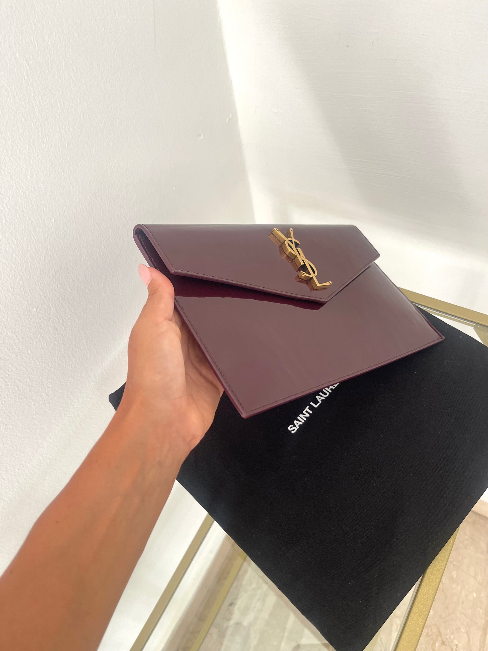 Pochette Uptown in pelle verniciata Saint Laurent