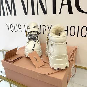 Stivaletti in pelle con shearling Miu Miu