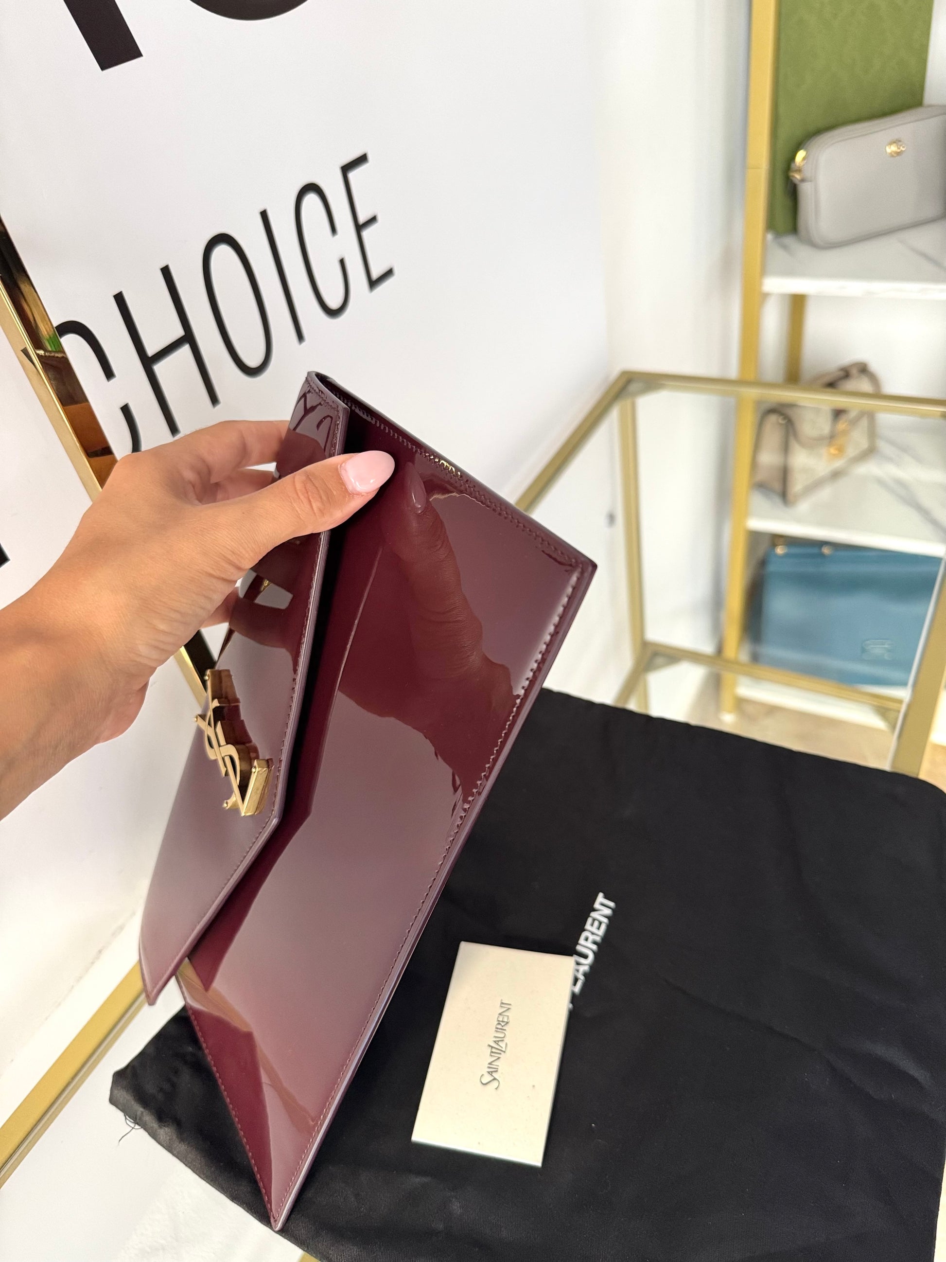 Pochette Uptown in pelle verniciata Saint Laurent