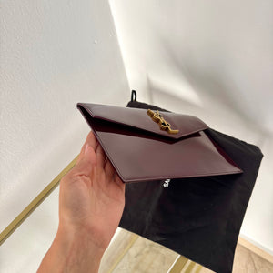 Pochette Uptown in pelle verniciata Saint Laurent