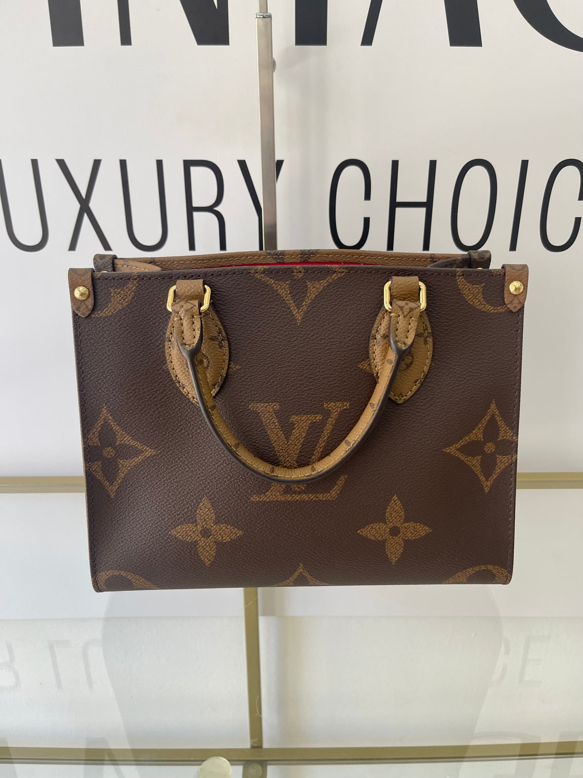 Borsa OnTheGo PM Monogram Reverse Giant Louis Vuitton