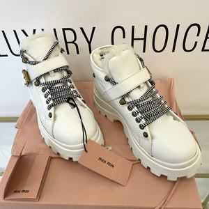 Stivaletti in pelle con shearling Miu Miu