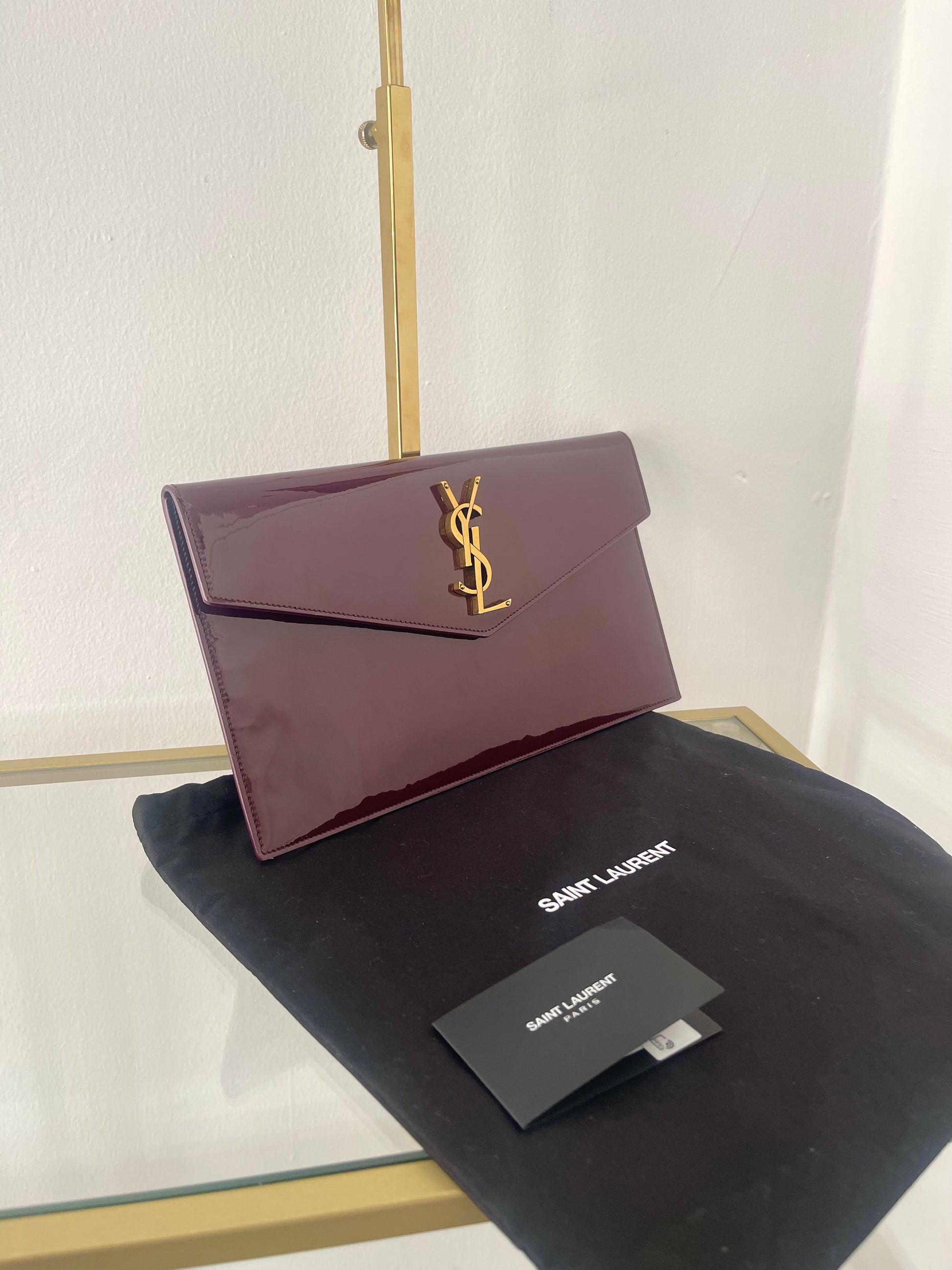 Pochette Uptown in pelle verniciata Saint Laurent
