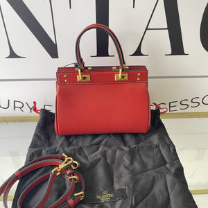 Borsa Rockstud Alcove Valentino Garavani in pelle granata